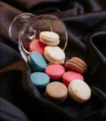 Close-up of a delicate macaron, showcasing its smooth shell and creamy filling, available at Kathmandu Fresh Bakery in Pokhara.