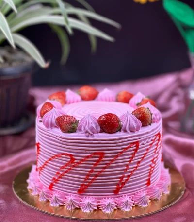 Close-up of strawberry cake texture showing moist layers and strawberry filling