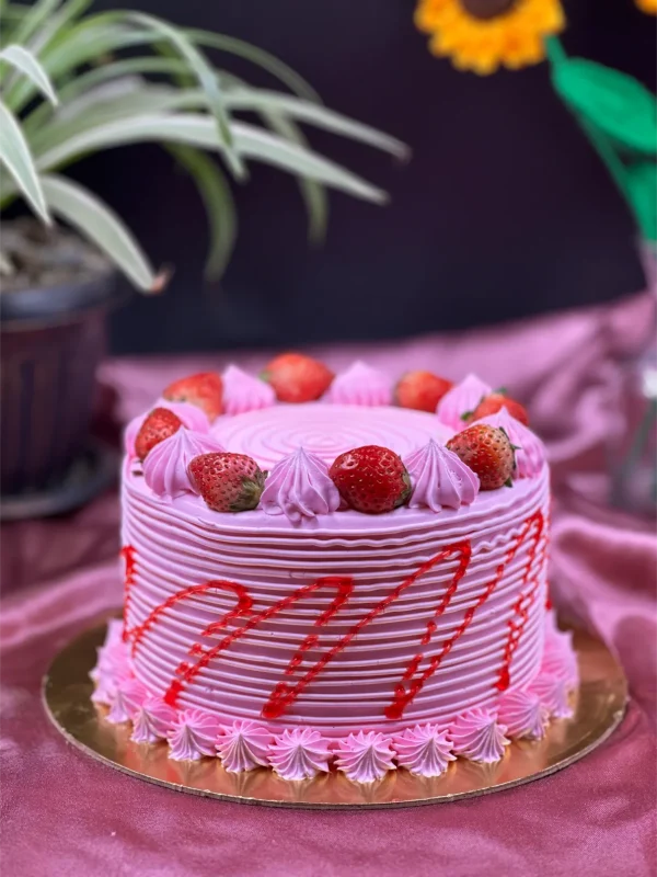 Close-up of strawberry cake texture showing moist layers and strawberry filling