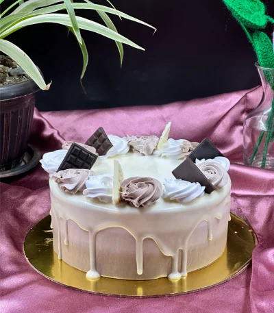 Slice of triple layer chocolate cake in Pokhara