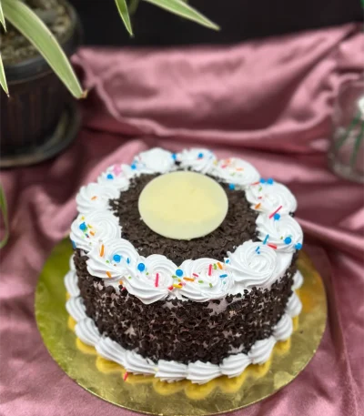 Slice of authentic Black Forest cake in Pokhara showing layers of chocolate cake