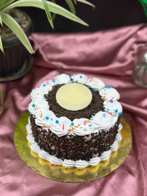 Slice of authentic Black Forest cake in Pokhara showing layers of chocolate cake