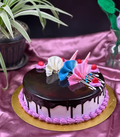 Fudgy close-up of layered chocolate cake with creamy ganache